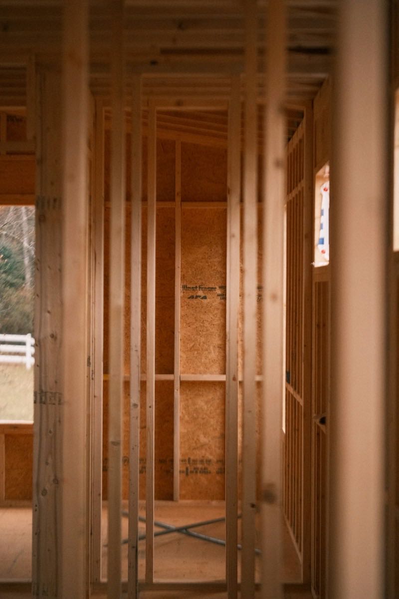 Partition walls and a door opening framed in dimensional lumber